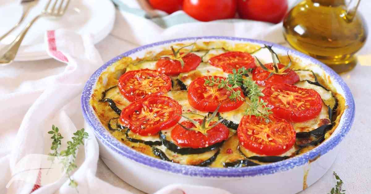 Vegan casserole with sliced tomato on top