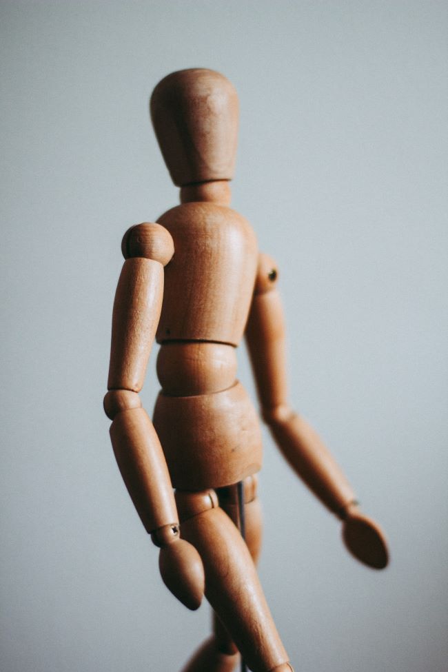 Wooden mannequin depicting bmi instead of human body