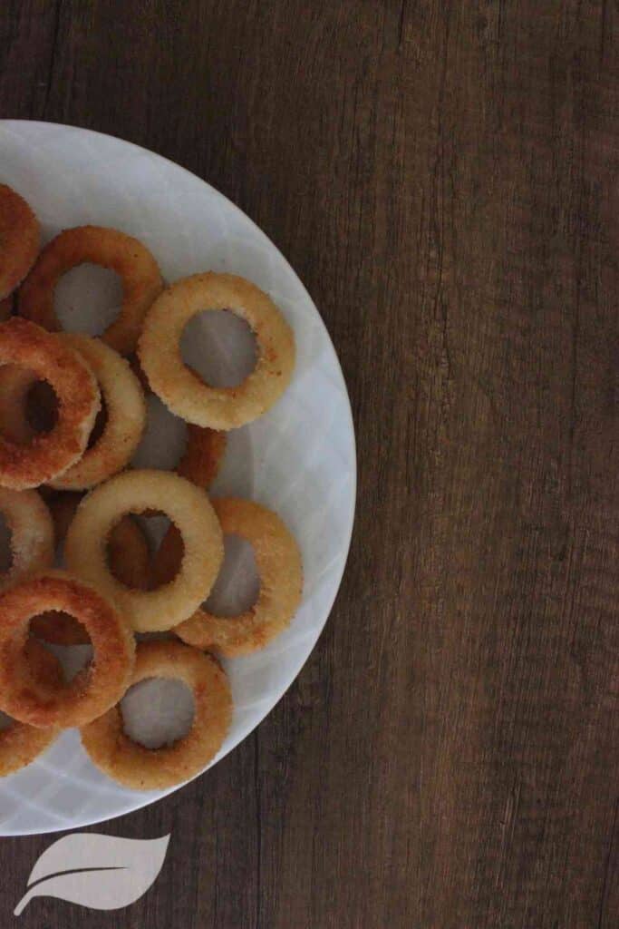 Gluten Free and Dairy Free onion rings on a white plate