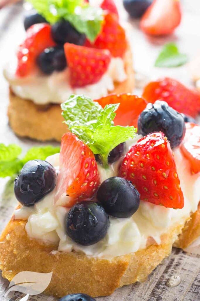 bruschetta with cream cheese, blueberries and strawberries to celebrate 4th july