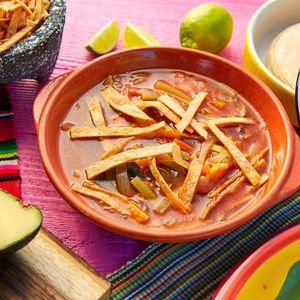 mexican soup in a wide brown bowl