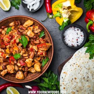 mexican chicken dish on a brown plate