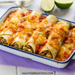 enchiladas in a white baking tray