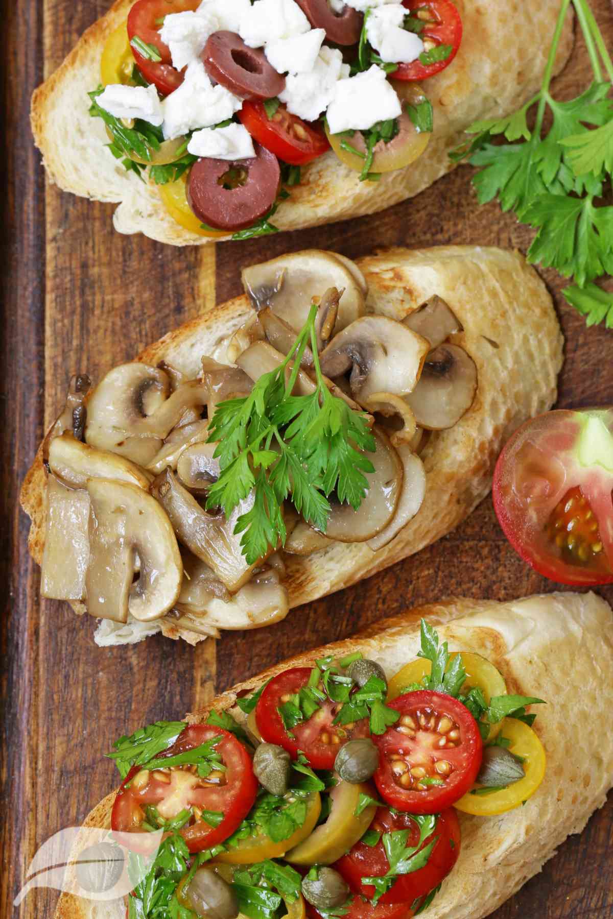 Bruschetta with mushrooms, tomatoes and olives