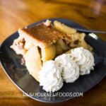 Stunning Fall Vegan apple pie Dessert with three blobs of fresh cream