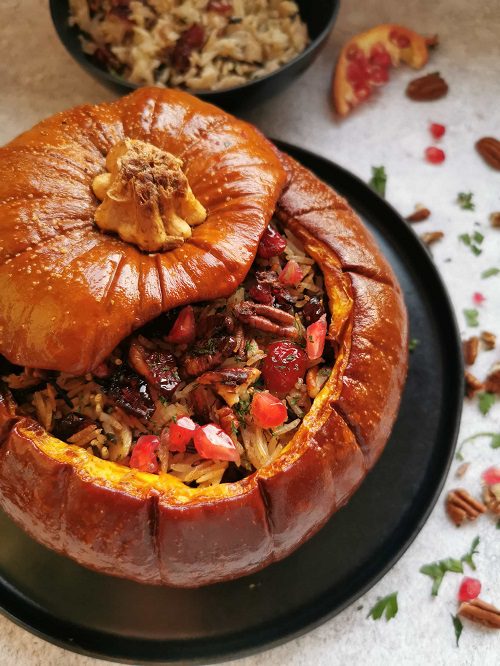 Vegan Thanksgiving Dinner Stuffed Pumpkin With Mushroom Rice And Cranberries