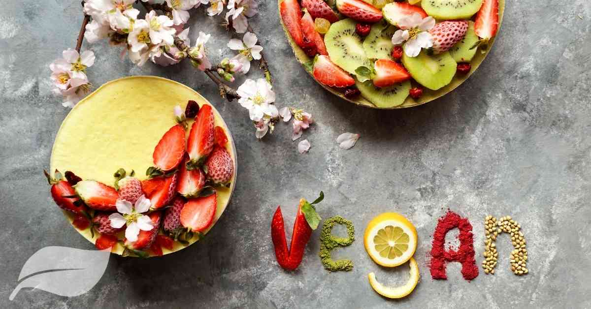 vegan fruit in bowls with vegan spelt out using fruit pieces