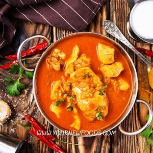Instant Pot chicken curry in a silver curry dish