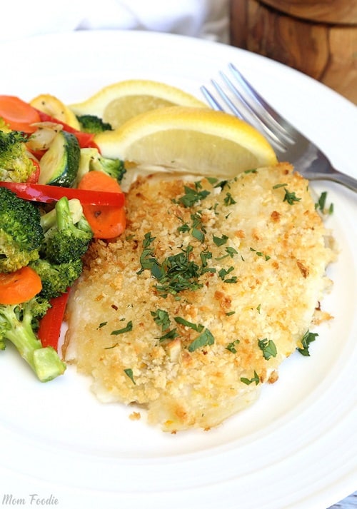 This easy Garlic Crusted Tilapia recipe with mayonnaise makes a family pleasing dish and it's perfect for busy parents. The baked tilapia dinner will be on the table in under 30 minutes. What a great way to get kids to eat seafood!
