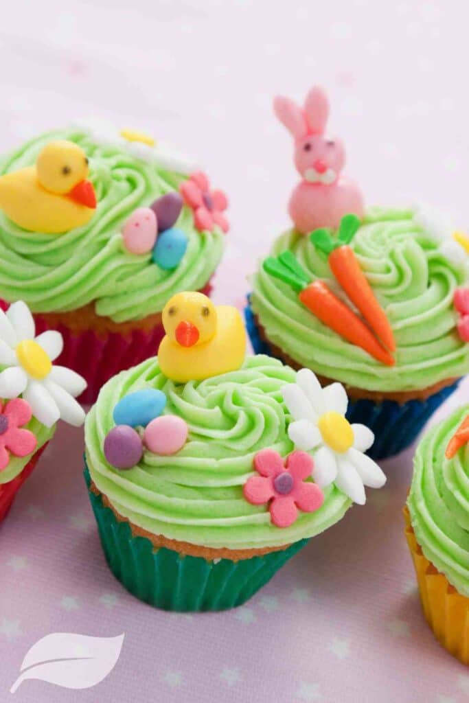 Easter cupcakes with mini carrots, bunnies, and chicks made with frosting