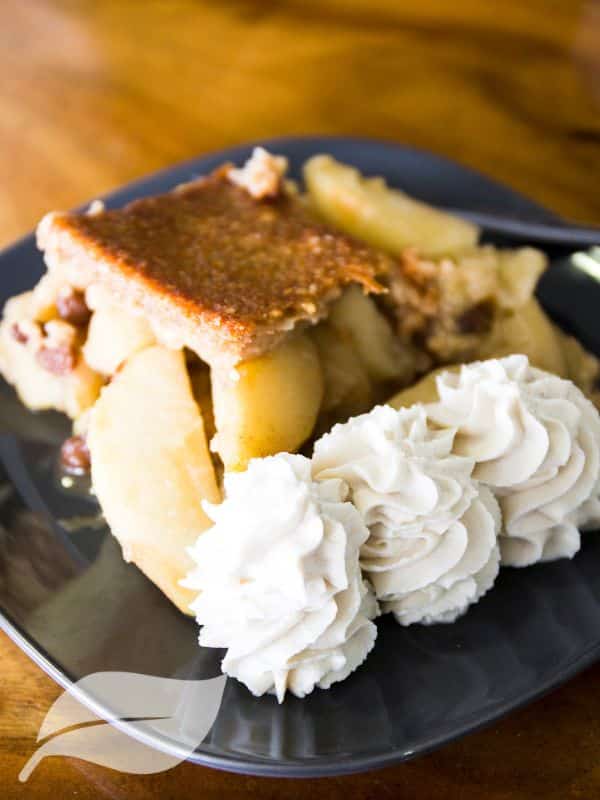 vegan apple pie with three quenelles of fresh cream